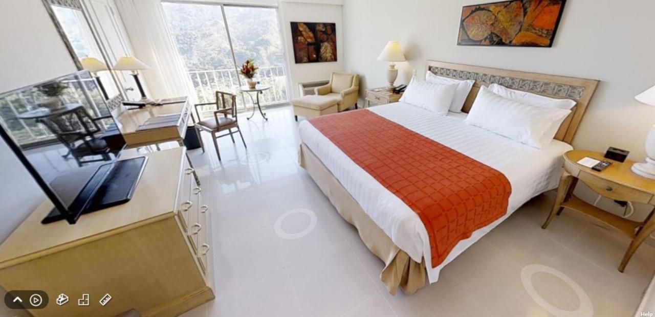Hotel Estelar Altamira Ibagué Buitenkant foto A room at the hotel